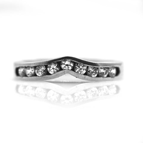 GoldQuest Jewelers in Boston channel set curved wedding band