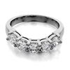 GoldQuest Jewelers in Boston shared prong set curved wedding band