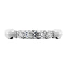 GoldQuest Jewelers in Boston shared prong diamond bezel on the side wedding band