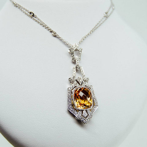 White gold handmade necklace with diamonds and precious center stone from GoldQuestJewelers near Boston MA