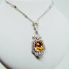 White gold handmade necklace with diamonds and precious center stone from GoldQuestJewelers near Boston MA