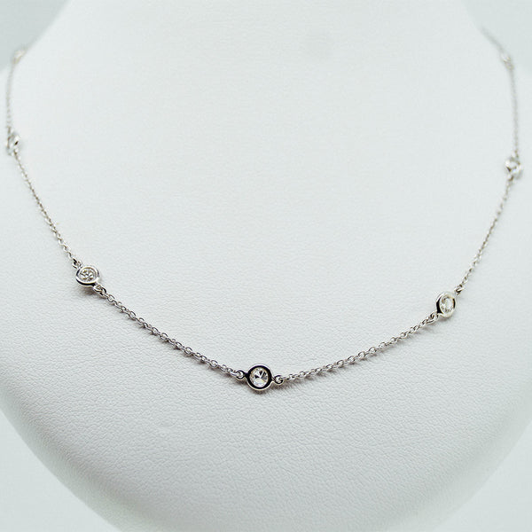 white gold with diamond dot station necklace from GoldQuestJewelers jewelry store in Boston MA