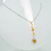 White gold handmade pendant with diamonds and citrine stones from GoldQuestJewelers near Boston MA