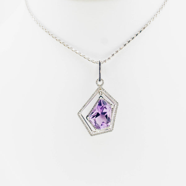 White gold handmade necklace with diamonds and precious stone center from GoldQuestJewelers near Boston MA