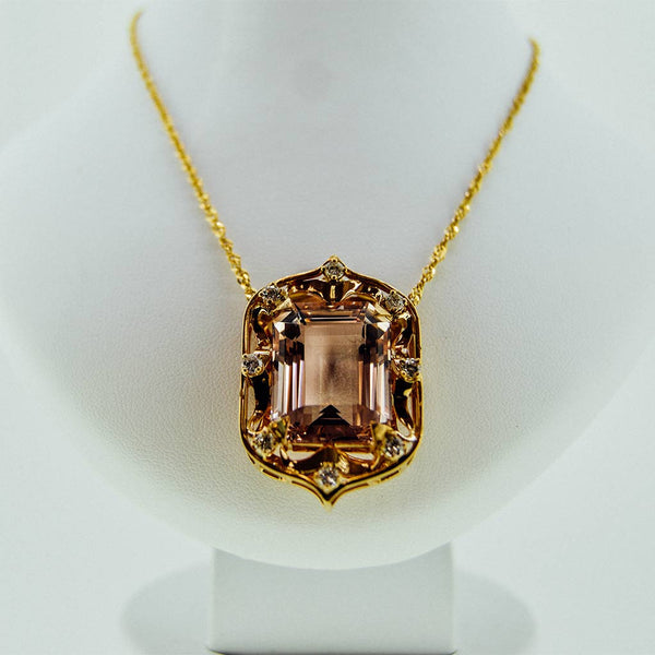 Yellow gold necklace with a precious stone center from GoldQuestJewelers near Boston MA