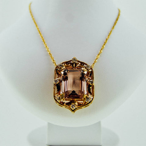 Yellow gold necklace with a precious stone center from GoldQuestJewelers near Boston MA