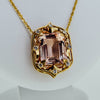 Yellow gold necklace with a precious stone center from GoldQuestJewelers near Boston MA